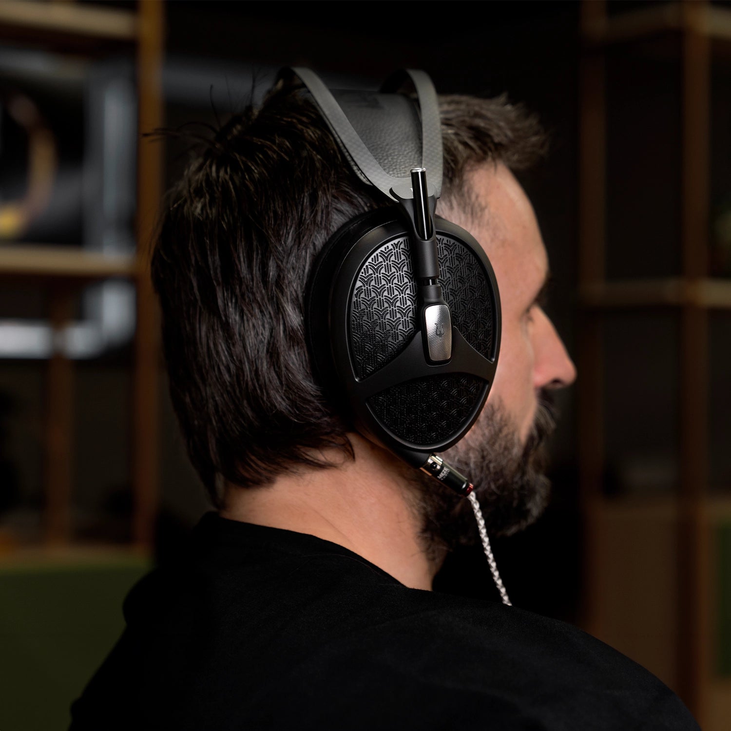 Back close-up of man wearing the Meze Audio Empyrean II premium hifi open-back audiophile headphone
