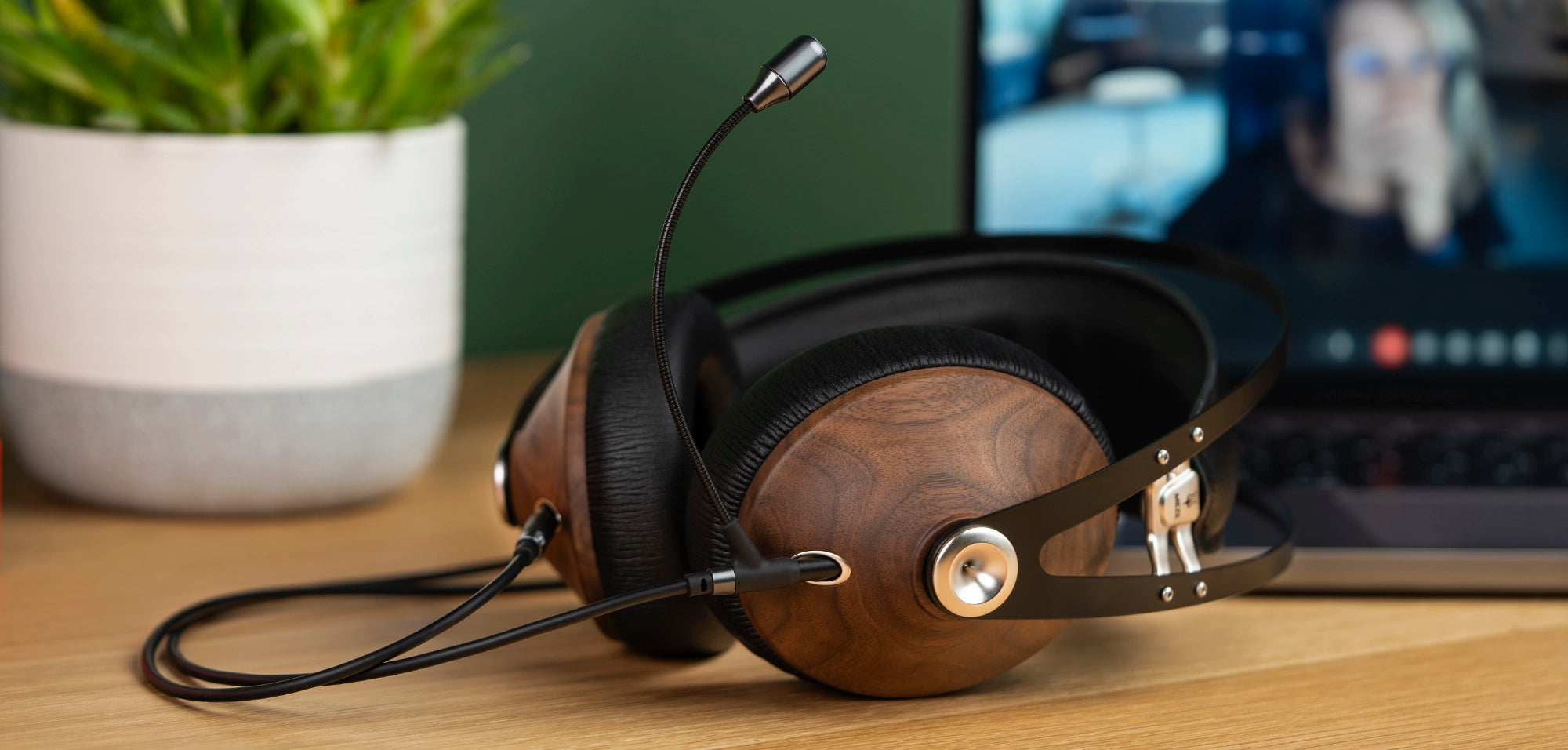 Meze Audio 99 Classics closed-back dynamic driver audiophile gaming headset resting on a wooden desk