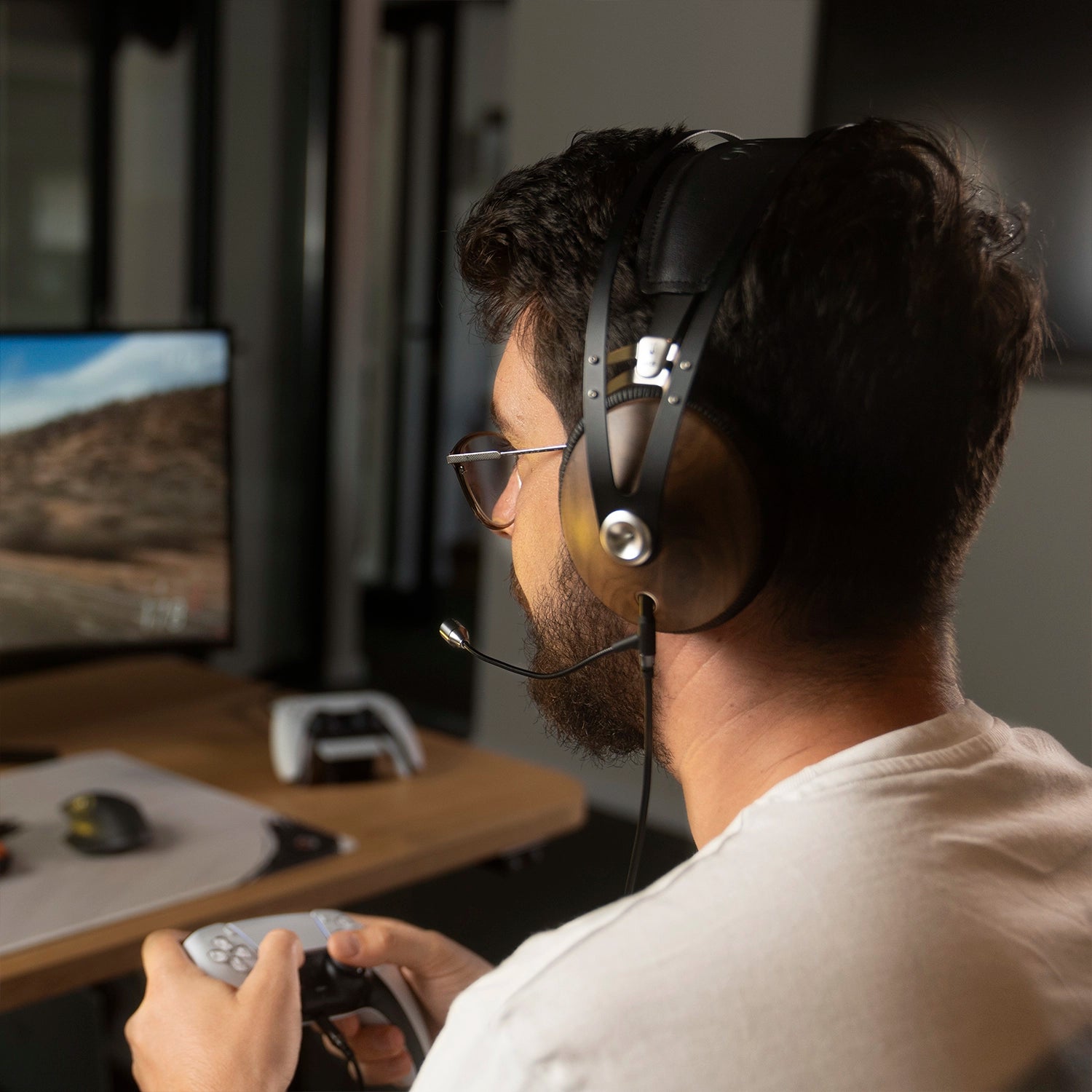 Player enjoying the Meze Audio 99 Classics closed-back dynamic driver audiophile gaming headset