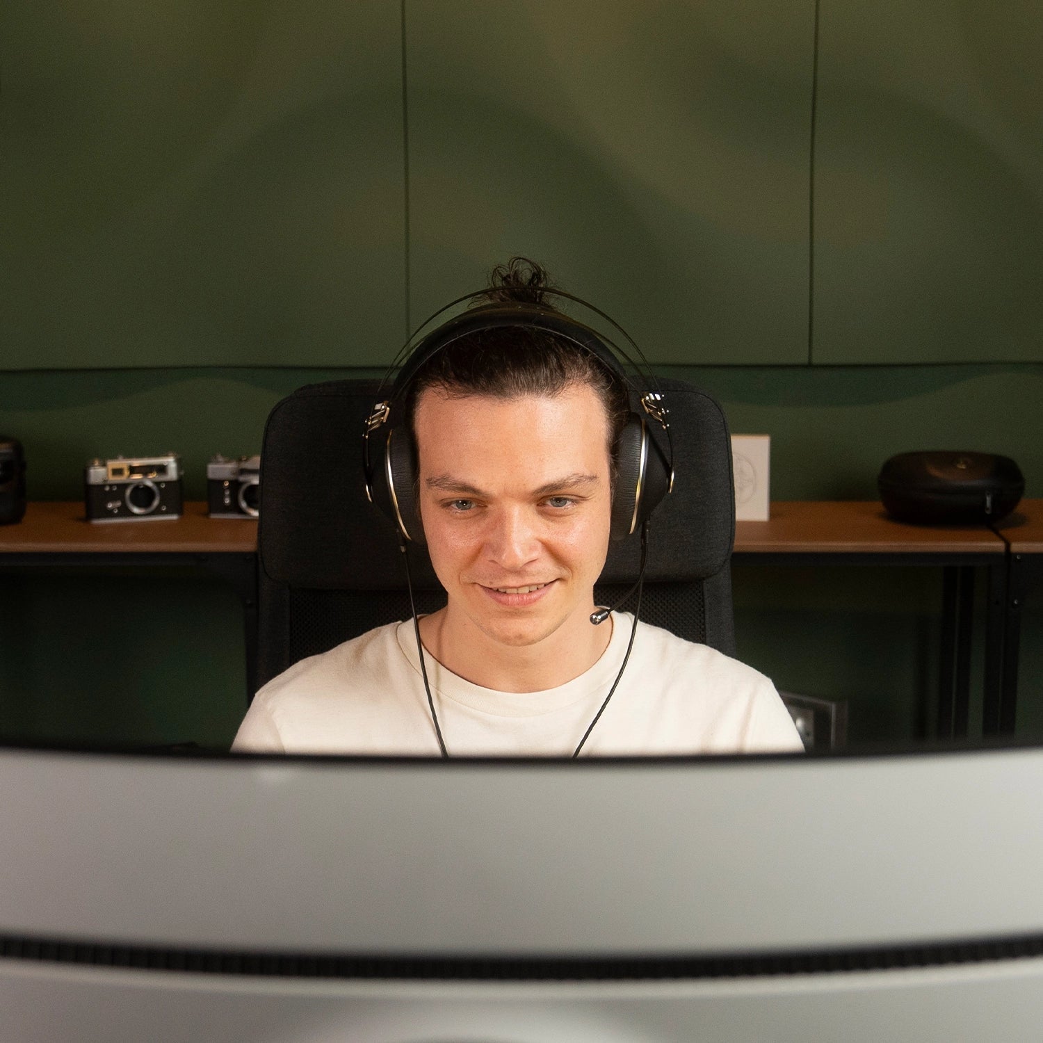 Player enjoying the Meze Audio 99 NEO closed-back dynamic driver audiophile gaming headset