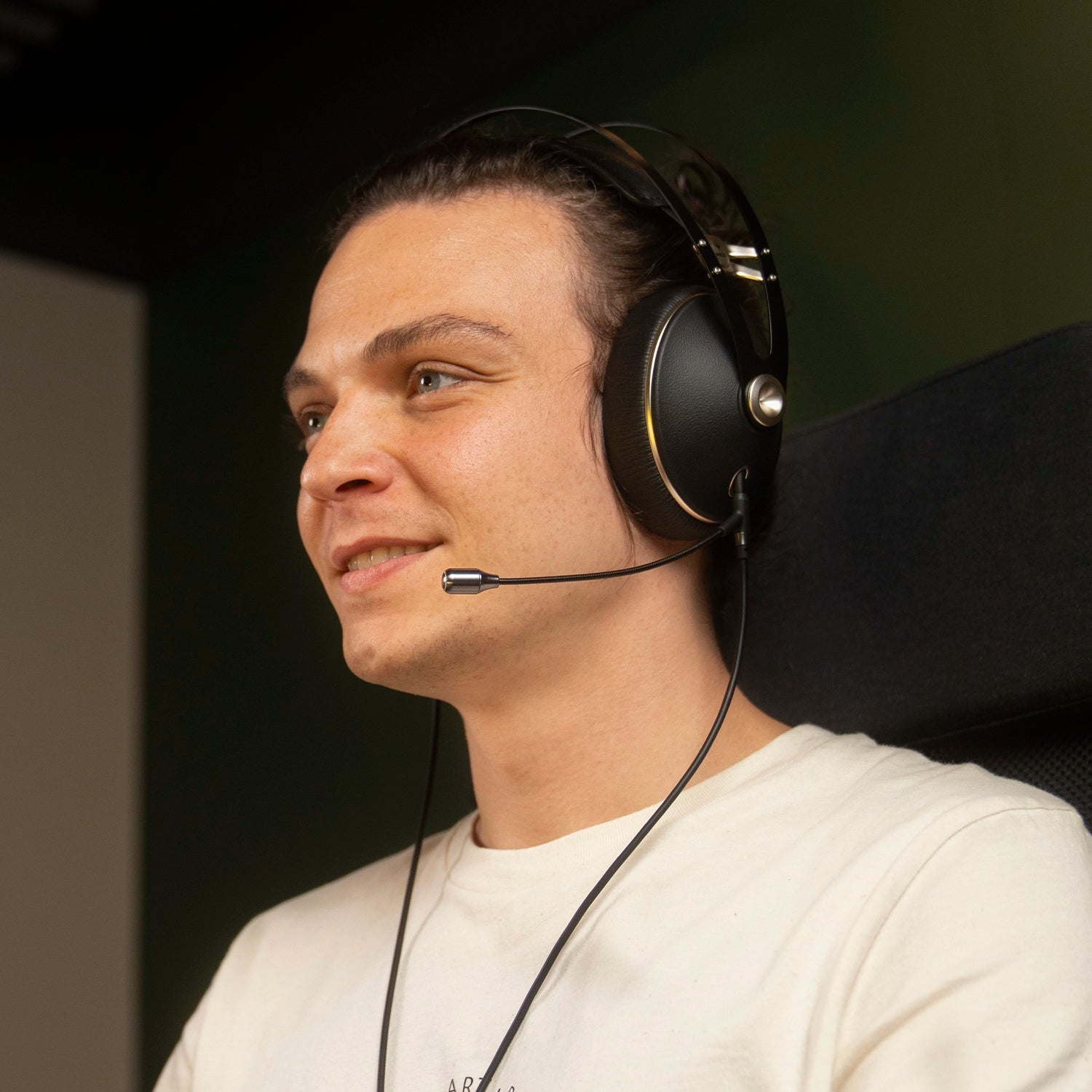 Player using the Meze Audio 99 NEO dynamic driver closed-back audiophile gaming headset during a remote work call