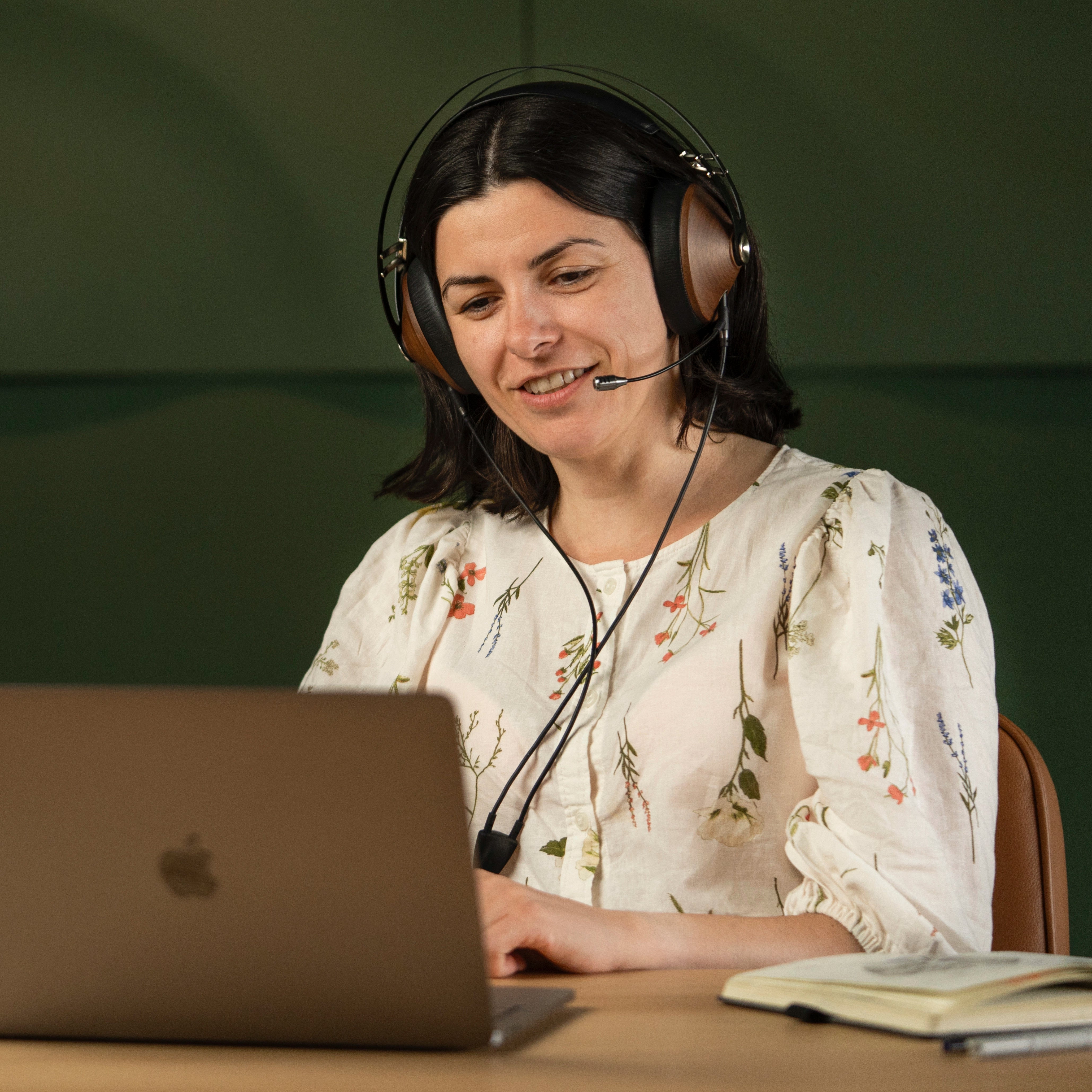 Player using the Meze Audio 99 Classics Walnut Gold dynamic driver closed-back audiophile gaming headset during a remote work call