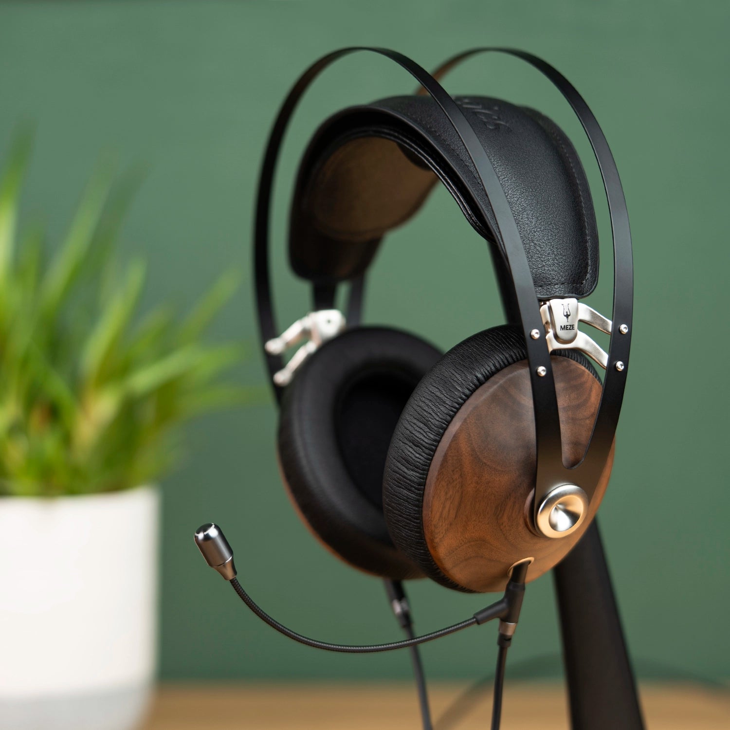 Meze Audio 99 Classics closed-back dynamic driver audiophile gaming headset resting on a wooden desk