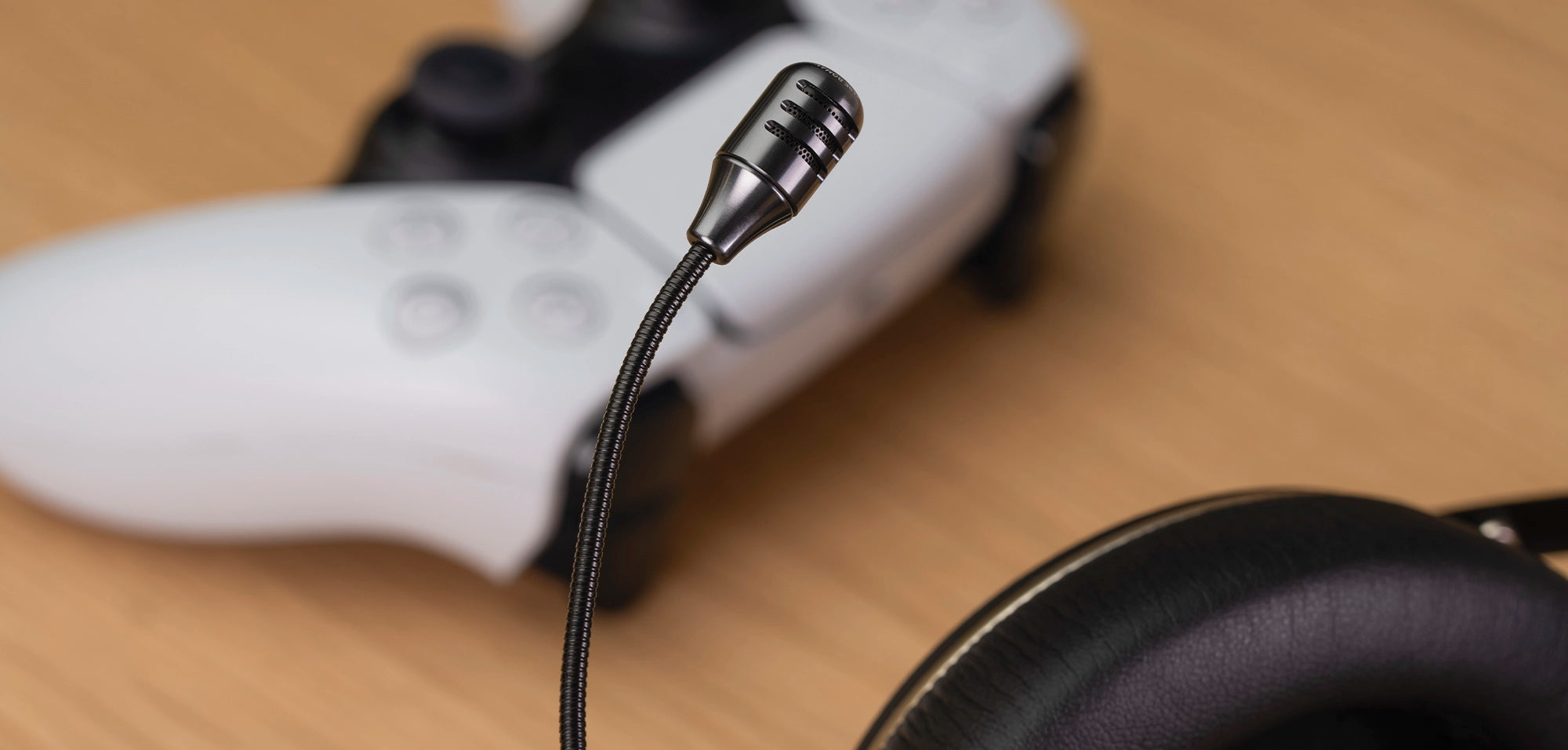 Meze Audio 99 NEO closed-back dynamic driver audiophile PS gaming headset close-up with gaming mic and PS5 controller