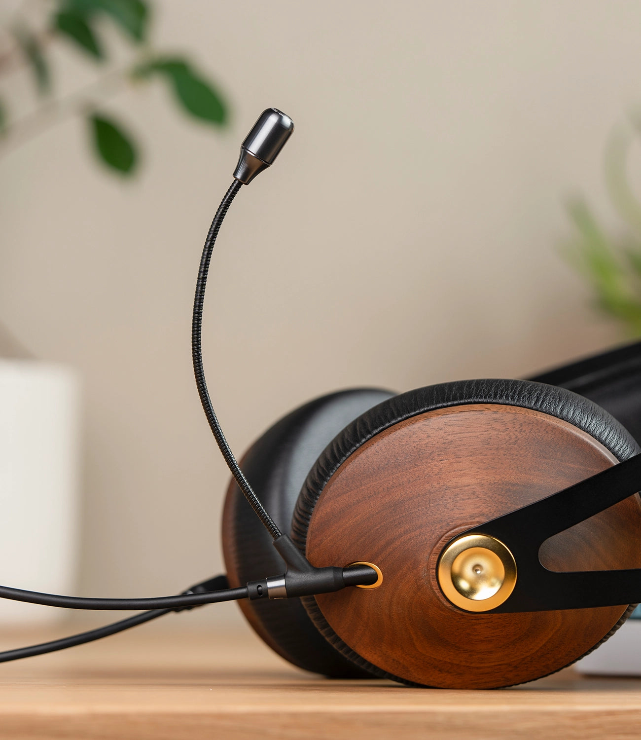 Meze Audio 99 Classics closed-back dynamic driver audiophile gaming headset resting on a wooden desk