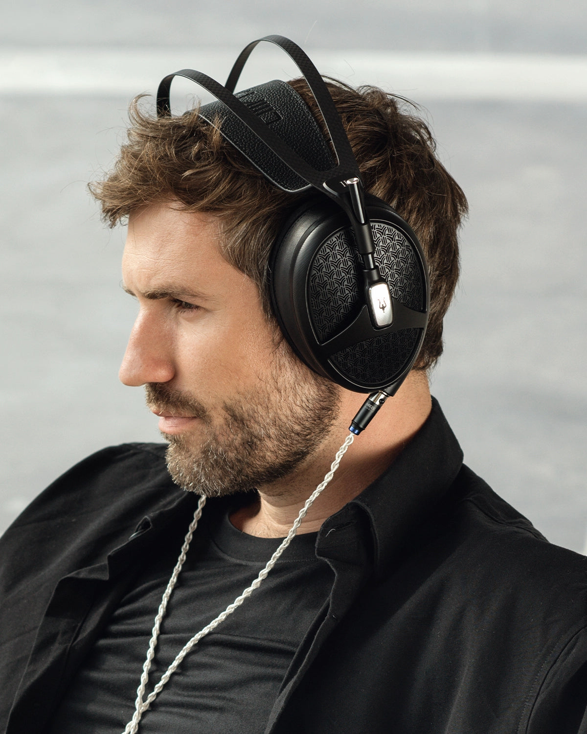 Man listening to Meze Audio Empyrean II premium built open-back planar magnetic driver headphones 