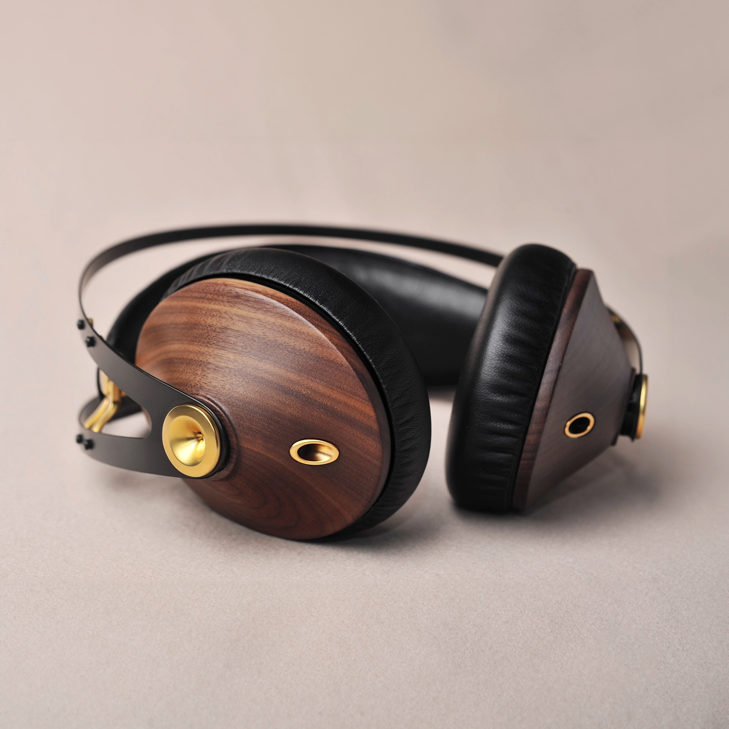 Premium closed-back audiophile headphones with walnut wood ear cups, highlighting high-fidelity sound and luxurious design for music enthusiasts.