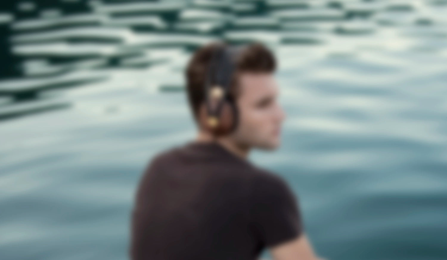 Man listening to the premium audiophile closed back headphones from Meze Audio