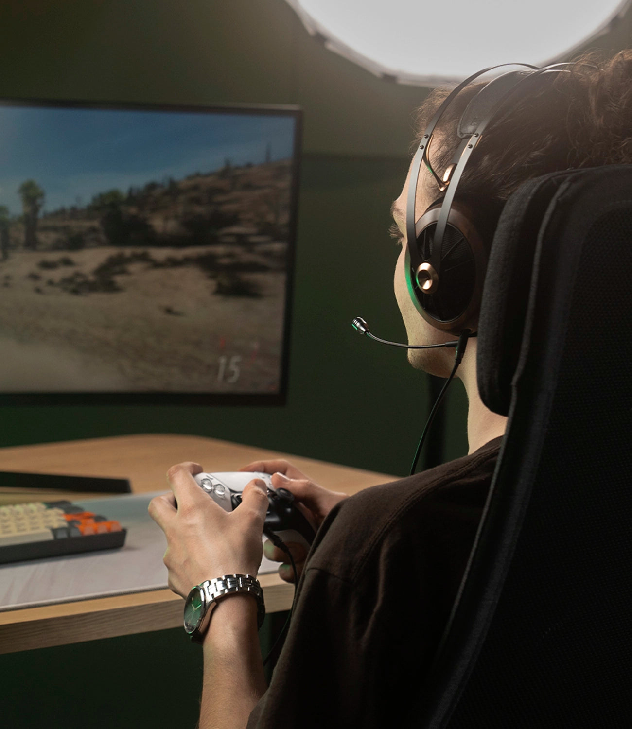 Player using the Meze Audio 109 PRO dynamic driver audiophile gaming headset during a PS5 car game