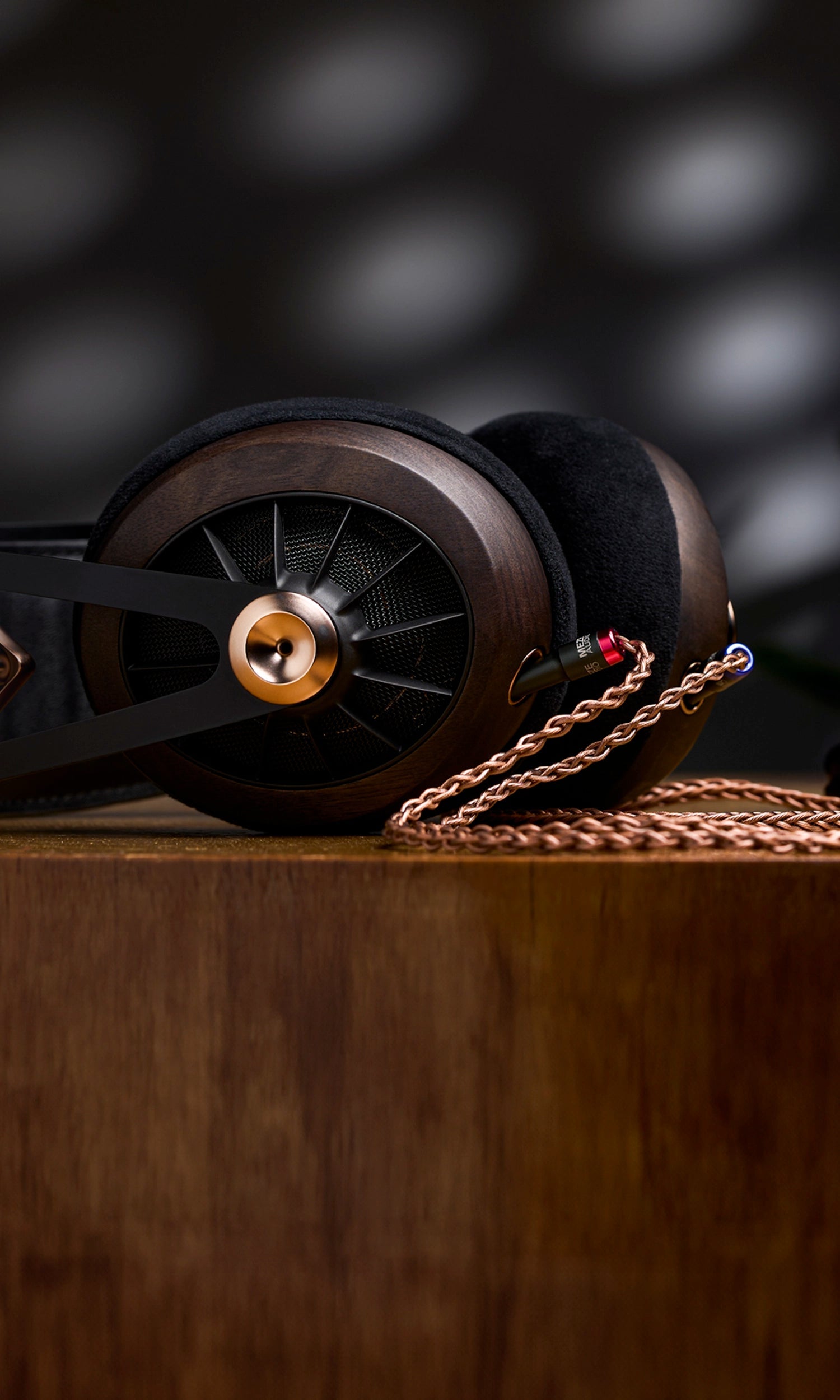 Meze Audio 109 PRO dynamic driver best audiophile open-back headphones on a wooden table with copper braided balanced cable 